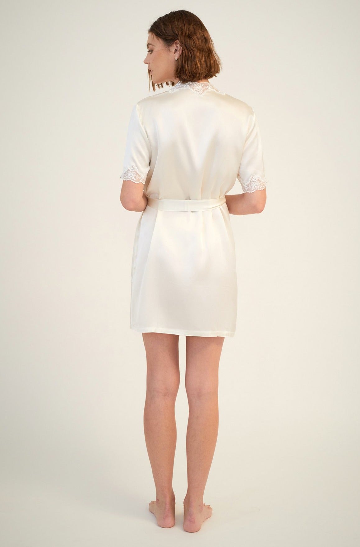 The Silk Short Wrap Gown with Lace Trim By GINIA In Creme